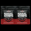 Two packages of Warrior Nasal Strips on a black background