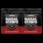 Two packages of Warrior Nasal Strips on a black background